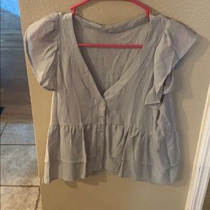 grey/green button up shirt.